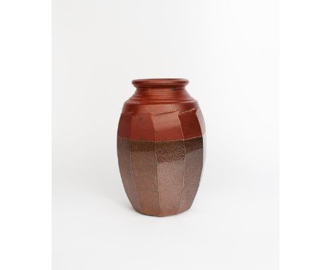 Richard Batterham  (1936-2021) a salt-glazed stoneware cut-sided jar, the neck and upper body glazed iron red over salt-glaze