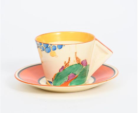 'Seven Colour Secrets' a Clarice Cliff Bizarre Conical coffee cup and saucer, painted in colours, the saucers with orange and
