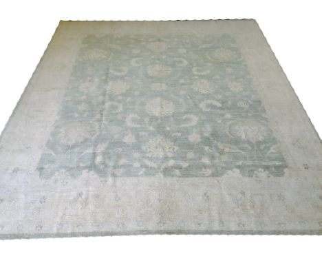 FINE ZIEGLER CARPET, 278cm x 251cm, all over scrolling palmette and vine design on a light jade field within complimentary ba