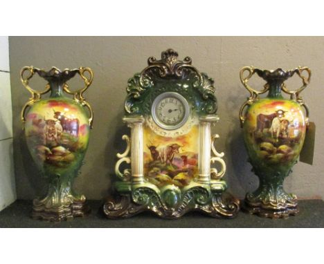 CERAMIC CASED MANTEL CLOCK, Edwardian decorated highland cattle scenes, 51cm H plus two matching vases 46cm H. (3) (with faul