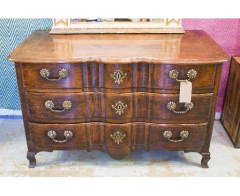 COMMODE, 18th century French Louis XV period oak, serpentine with three long drawers, 132cm x 66cm D x 82cm H.