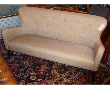 SOFA, 190cm L x 99cm H 1960's style, with a buttoned back on short wooden turned supports. 