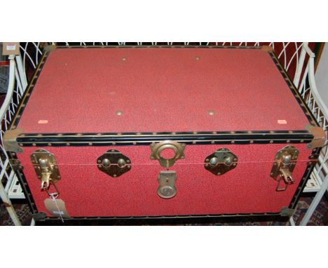 A canvas clad hinged top travelling trunk, with end carry handles, w.83cm