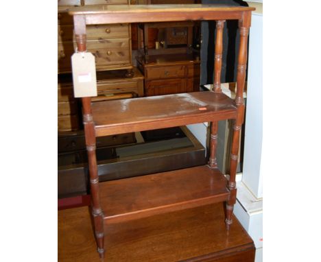 A 19th century mahogany narrow round cornered three-tier whatnot raised on ring turned columns, width 54cm