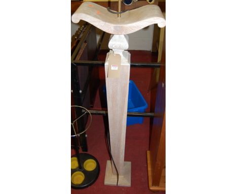 A contemporary limed oak pedestal standard lamp, raised on square tapering column, h.153.5cm (including fitting)