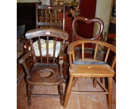 An early 20th century childs elm and rush seat Lancashire chair; together with two childs commode chairs; and a childs elm st