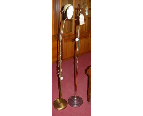 A contemporary brushed brass twin adjustable floor light; together with a brass column floor light (2)