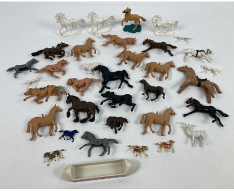 A collection of vintage plastic horse figures in varying colours, to include examples by Britains. 