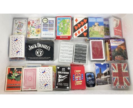 A collection of 32 sets of playing cards, some still sealed. To include Jack Daniels sealed pack in collectable tin, souvenir