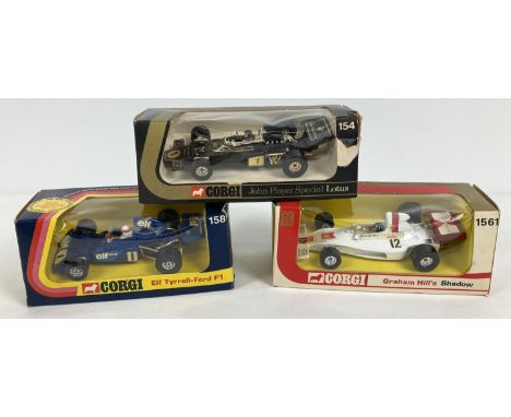 3 boxed vintage F1 racing cars by Corgi. Elf Tyrell-Ford #158, Graham Hill's Shadow #1561 and Emerson Fittipaldi John Player 