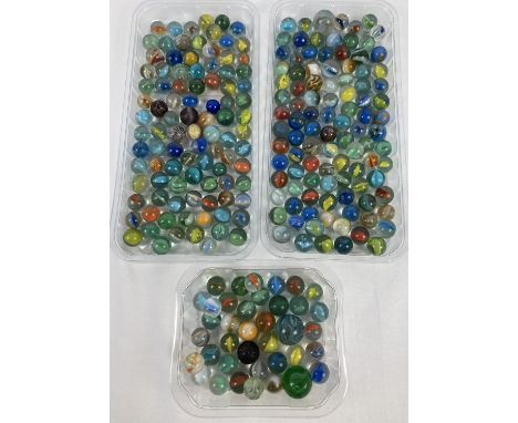 A collection of vintage glass marbles to include core swirl, banded swirls and opaque. In varying sizes, colours and conditio