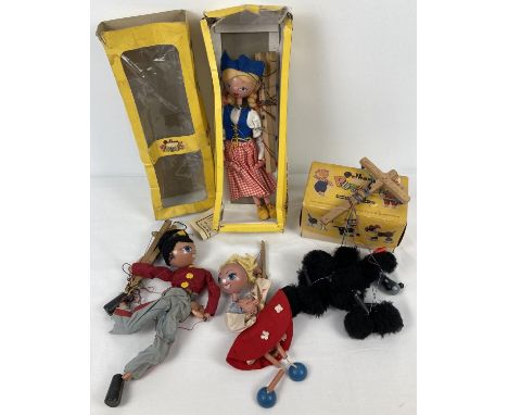 2 boxed vintage Pelham puppets. A Dutch girl and a black poodle.  Together with 2 other Pelham puppets for spares or repair, 