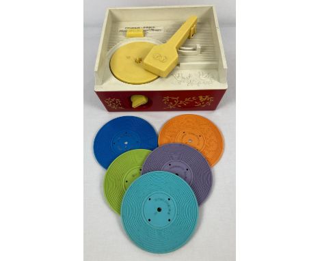 A vintage Fisher Price Music Box - Record Player, complete with 5 records. Works infrequently, although winding mechanism is 