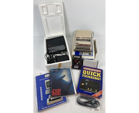 A vintage 1980's Sinclair ZX 81 home computer with programming book, power pack, leads, Mirrorsoft Quick Thinking and Pathfin