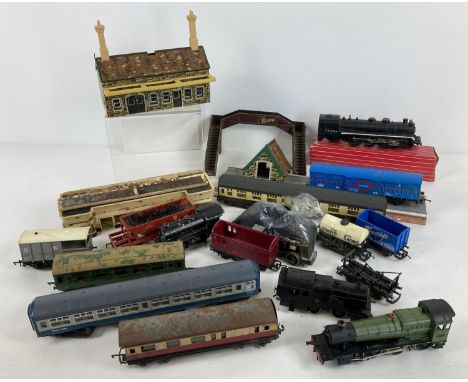 A tub of assorted vintage accessories, wagons and locomotives in varying sizes and conditions. To include Hornby OO gauge. 