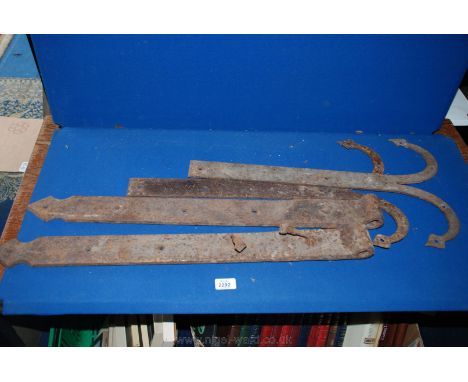 A good pair of decorative 17th century wrought iron hinge mounts with flared arrow terminals and a pair of heavy 18th century
