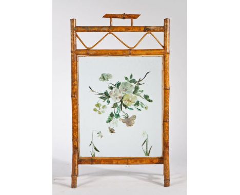 Early 20th Century bamboo fire screen, the handle above a wavy line and flower painted glass panel on V end supports, 53cm wi