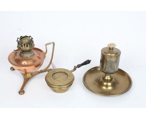 Arts and Crafts style oil lamp, with copper reservoir above a brass handle and tripod foot, W.S.L. Co. Ltd oil lamp, the bras