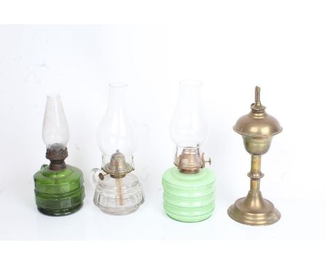 Wight and Butler brass spirit burner, Falks hand oil lamp with green glass reservoir, two similar oil lamps (4)