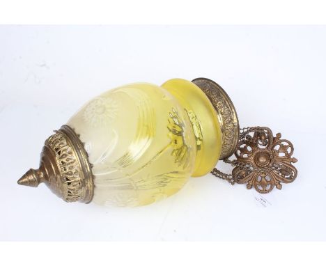 Yellow glass lamp shade, with fleur de lys cast ceiling mount, the shade with foliate decoration above a pierced brass lower 