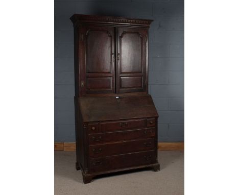 George III Oak Bureau Bookcase, the Bureau with a sloping fall opening to reveal fitted interior together with a column desig