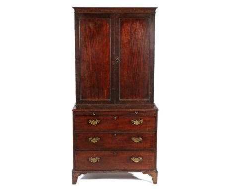 George III mahogany bookcase on chest, the concave cornice above a pair of panelled doors enclosing adjustable shelves, the b