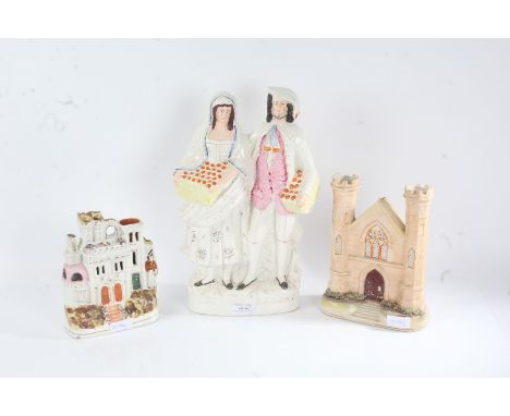 19th century Staffordshire figure group 'Orange Sellers', 36cm tall, and two others of architectural form (3)