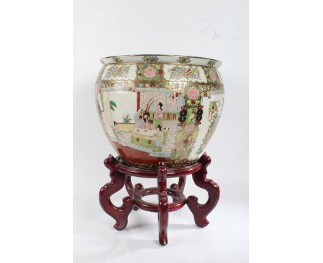Chinese Canton style gold fish jardeniere on stand, decorated with figure, flowers and birds, 51cm tall, 36cm diameter