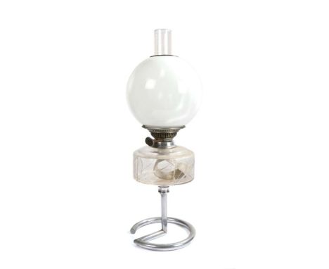 Best British Make oil lamp, with clear glass chimney and white glass globe form shade above a clear glass reservoir with etch