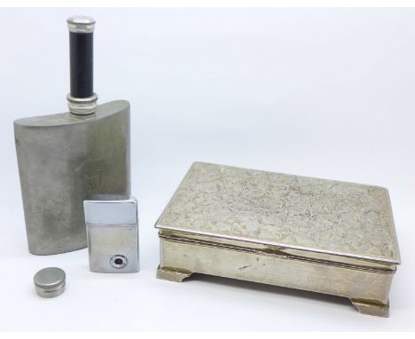 A cigarette box, hip flask and lighter