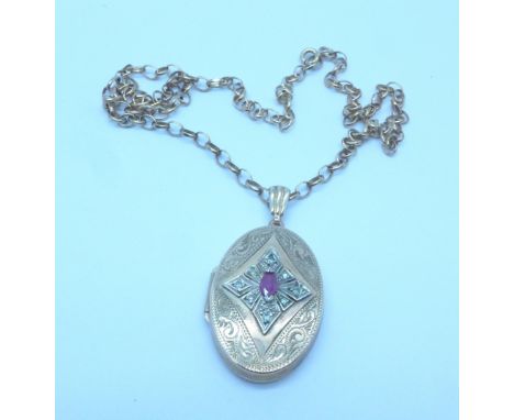 A 9ct gold, diamond and ruby locket and chain, 10.4g