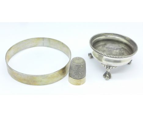 A Victorian silver salt, a bangle marked 'sil' and a silver thimble, 57g