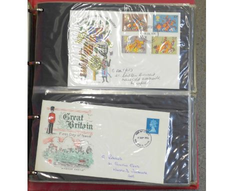 An album of stamp first day covers, seventy-eight in total and four Royal Mail mint stamps