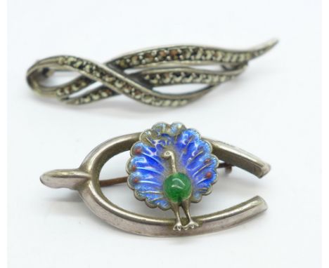 A hallmarked silver and enamel peacock brooch, enamel a/f, and a sterling silver and marcasite brooch