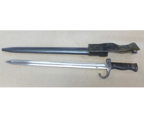 A bayonet and scabbard with canvas frog