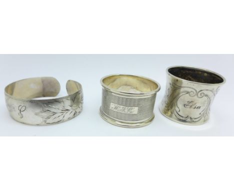 An .830 silver napkin ring, a hallmarked silver napkin ring and a sterling silver bangle, 47g