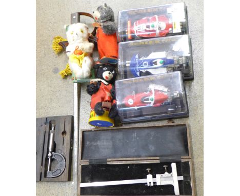 Toys; three Scalextric racing cars, three clockwork toys, a tin sword and two engineers tools