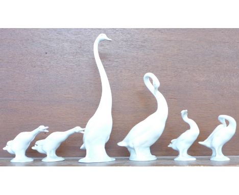 Four Lladro geese and two tall Nao geese