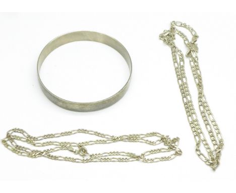 Two silver chains, one clasp a/f, and a white metal bangle, tests as silver, 44.8g