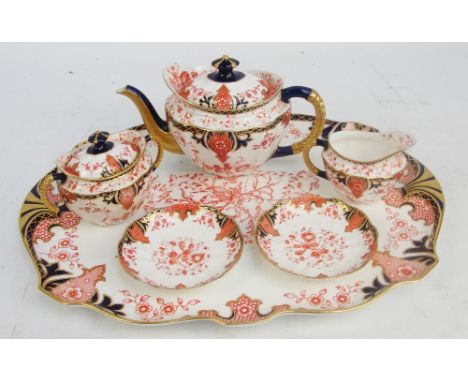 A Royal Crown Derby teapot, matching sucrier and cover, jug, two saucers and large tea tray, width of tray 45cm. CONDITION RE