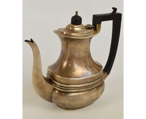 An Edward VII  hallmarked silver coffee pot of oval baluster form with angled ebonised handle and finial, S. Glass, Birmingha