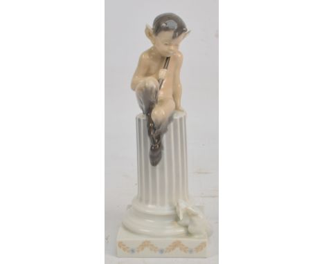 A Royal Copenhagen model of Pan seated upon a column with flying squirrel at the base, printed marks, numbered 456, height 22
