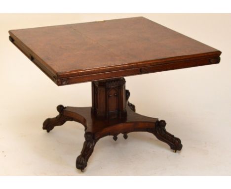 A very unusual 19th century Pollard oak centre table, the square moulded crossbanded top carved to the corner friezes with an