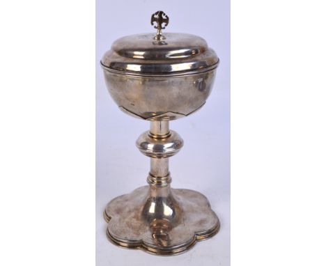 A white metal ciborium and cover, with plain Edward VII hallmarked silver bowl on shaped cut-card work calyx above a cylindri