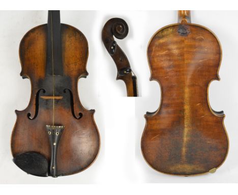 A full size German violin, the two-piece back with wax seal below the button, length 35.7cm, with a bow, uncased.