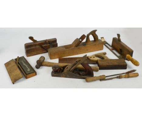A small quantity of woodworking tools including planes.