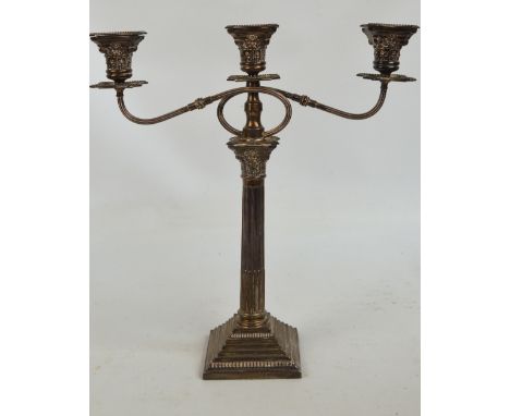 A George V hallmarked silver three branch candelabrum modelled as a Corinthian column raised on stepped base with Corinthian 