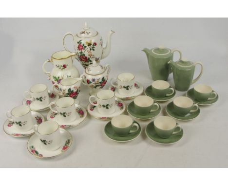 A Poole two tone glazed coffee set comprising a coffee pot, a hot water jug, and six cups and saucers, and a further Wedgwood