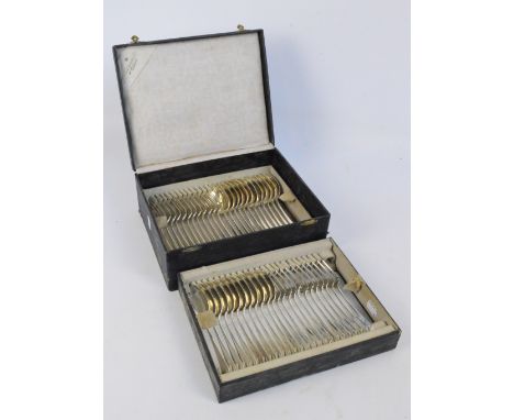 A cased set of Dutch hallmarked 833 standard silver flatware comprising twelve tablespoons and forks, and twelve dessert spoo