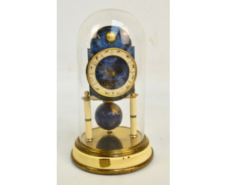 J. KAISER, GmbH VILLINGEN; a mid 20th century German brass anniversary clock, the circular base decorated with celestial moti